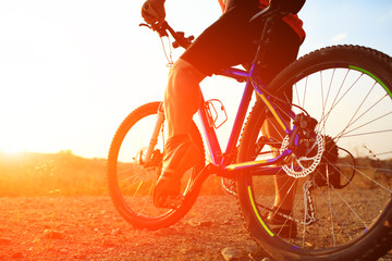 Fototapeta premium low angle view of cyclist riding mountain bike 