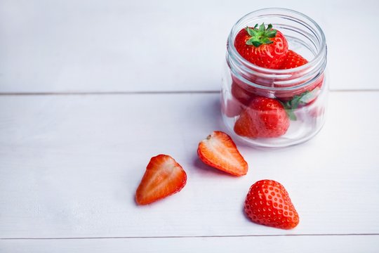 Glass jar of fresh strawberries