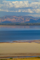 Great Salt Lake and Wasatch Mountains in evening from Antelope Island State Park in Utah