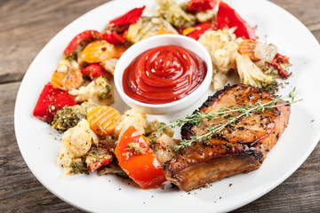 Grilled pork chop and steamed vegetables