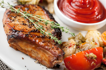 Grilled pork chop and steamed vegetables