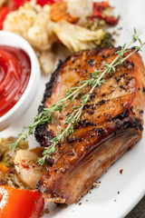 Grilled pork chop and steamed vegetables