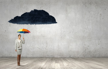 Businesswoman with umbrella