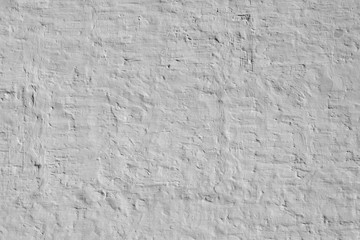 Old Uneven Brick Wall With White Painted Plaster Background