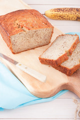 close up of banana bread on wooden chopping board