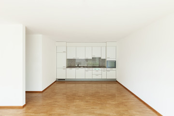 empty living room with kitchen