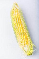 Cob of corn  isolated on white background © aneta_gu