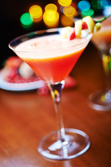 red tropical alcohol cocktail or lemonade with decoration.