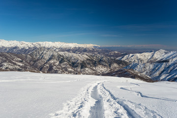 Fototapeta na wymiar Mountaineering in fresh snow