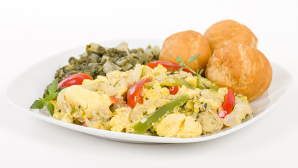 Ackee & Saltfish - Traditional Jamaican dish made of salt cod and ackee fruit. Served with callaloo and johnny cakes.
