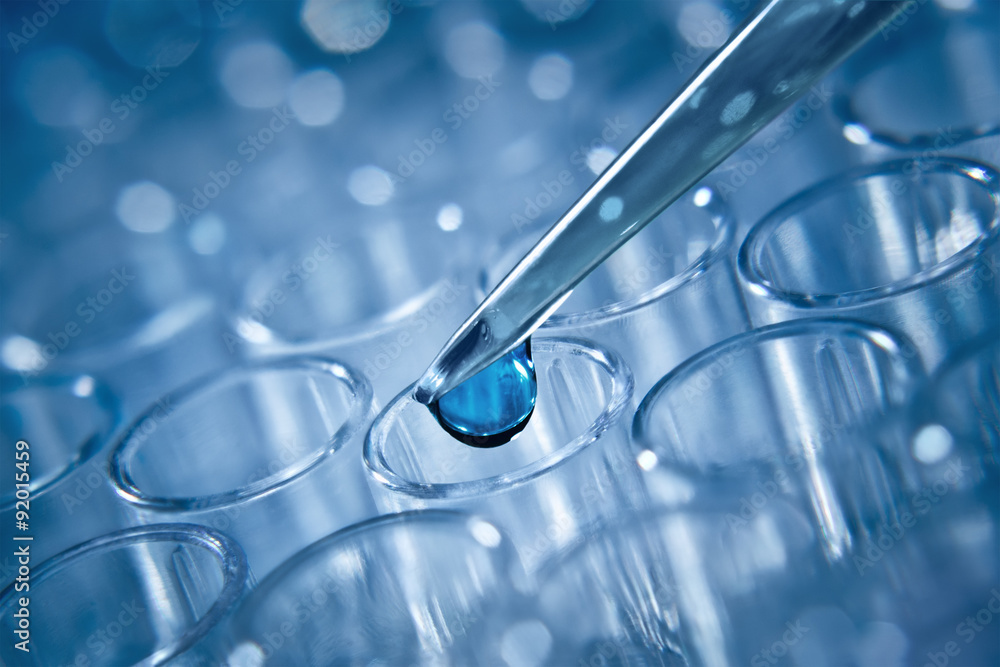 Wall mural macro shot of dozator tip and plastic plate for immunosorbent as