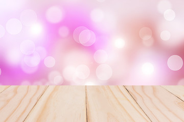 Wooden table with Pink bokeh