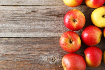 Fototapeta na wymiar Red apples on grey wooden background