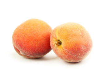 Fresh peaches fruit isolated on a white