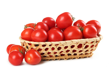 Fresh red tomatoes in basket isolated on white