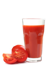 Fresh red tomatoes and tomato juice in glass isolated on white