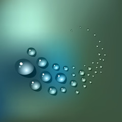 Water drops on a blue bokeh background.