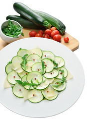 salad of zucchini with cheese and arugula on isolated background