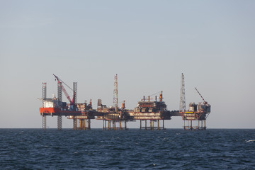 Fototapeta na wymiar Offshore oil platform at sunny day