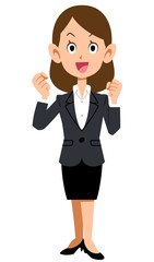 スーツを着た女性が笑顔でやる気を表現する