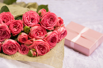 Wedding bouquet of beautiful pink roses with gift box for jewelry