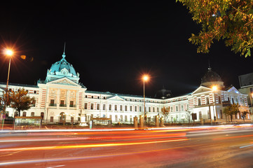 Fototapeta na wymiar Bucharest, Romania – October 27, 2012 – Night traffic on Bratianu Boulevard in Bucharest, Romania.
