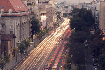 Fototapeta na wymiar Bucharest, Romania – September 18, 2015 – Night traffic on Magheru Boulevard in Bucharest, Romania.