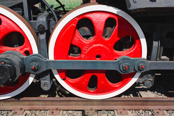 Old steam locomotive painted wheels.