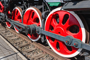 Old steam locomotive painted wheels.