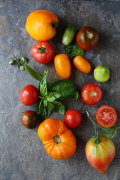 fresh ripe tomatoes on slate