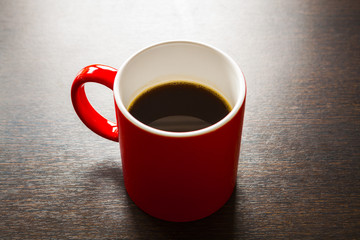 Long coffee in red mug