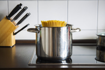 pot of spaghetti on stove in kitchen
