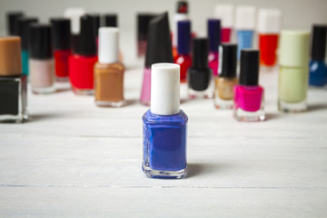 Nail polish bottles, blue in front