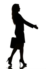 silhouette of a busy business woman backlight studio