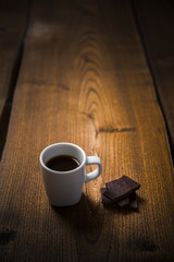 Cup of espresso with dark chocolate