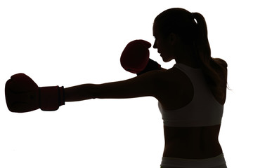 one caucasian woman boxing exercising in silhouette studio isola - 92029037