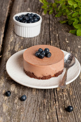 Mini-cheesecake and chocolate biscuits and blueberries