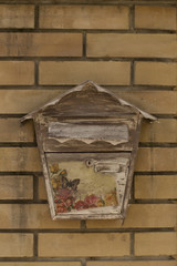 Old mailbox on a brick wall