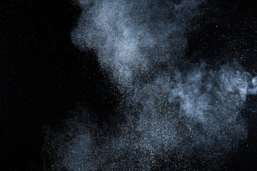 abstract white dust explosion  on black background. abstract white powder explosion  on black background. abstract texture.
