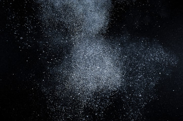abstract white dust explosion  on black background. abstract white powder explosion  on black background. abstract texture.