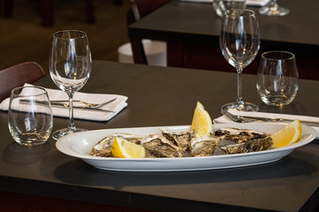 fresh oysters on ice with lemon