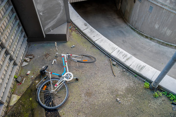 Abandoned bicycle near entrance to an underground parking