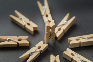 Clothespins on an abstract scene on a black background