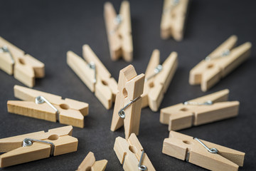 Clothespins on an abstract scene on a black background