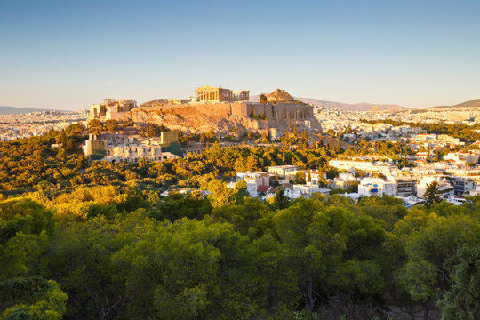 Evening view of Acropolis from Filopappou hill in central Athens.