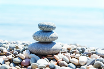 Fototapeta na wymiar stack with stones on sea beach. zen-like