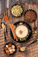 Obraz na płótnie Canvas Indian masala chai with spices. Tea with milk and spicy