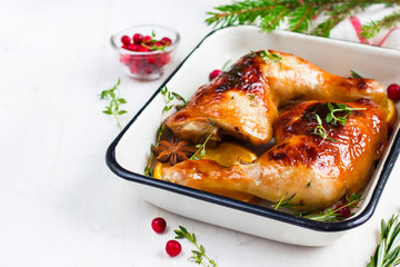 roasted chicken leg with orange and spicy herbs
