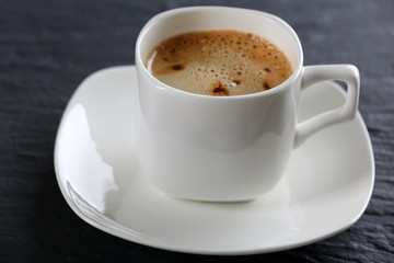 Cup of coffee on table close up