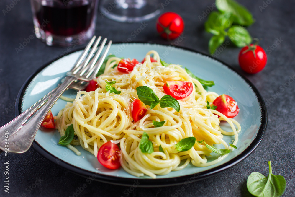 Wall mural Spaghetty pasta  with cherry tomatoes,  basil and parmesan chees